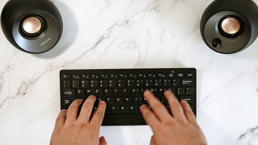 Typing on a black keyboard